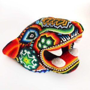 Jaguar head intervened with huichol art